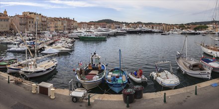 Luxury yachts and fishing boats in the port of Saint-Tropez