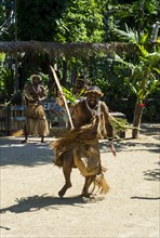 Man practising a traditional war ceremony