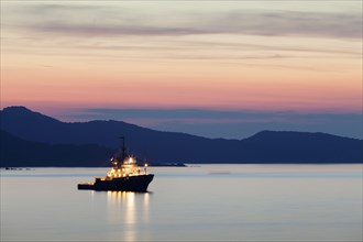 Boat at sunset on the Gulf of Saint-Florent