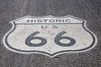 Route 66 sign on asphalt