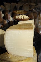 Parmesan and other hard cheeses on display at the annual All Saints Market in Cocentaina