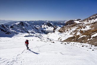 Mountain climber ascending Wilde Kreuzspitze Mountain in the Pfunderer Mountains