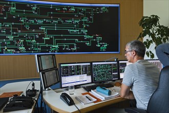 Engineer sitting at his work station in the Transmission Control Center