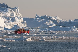Boat between icebergs