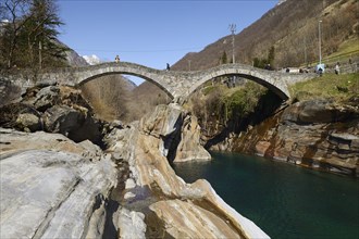 Historic bridge Ponte dei Salti with double arches through the Verzasca River