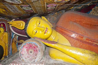 Brightly painted reclining Buddha figure