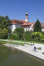 Promenade on the Neckar River with the former Carmelite monastery