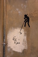 Stencil pretending to clean up grafitti