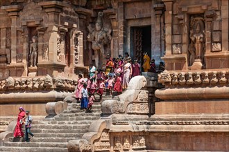 Devout Hindus and children descending a staircase