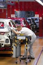 Man working on the production line of the Audi A3 at the Audi plant