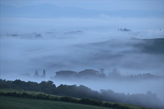 Early morning fog in the valleys of the Crete Senesi