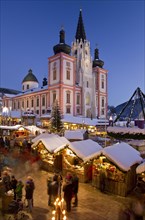 Christmas market in front of the Mariazell Basilica at the blue hour