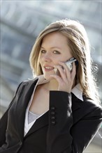 Business woman using a mobile phone