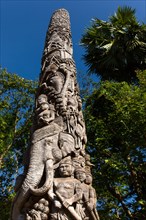 Decorative wooden pillar in the courtyard of Wat Doi Ngam Muang