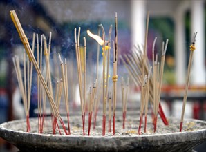 Joss sticks in front of the Wat Phra Si Rattana Mahathat Temple