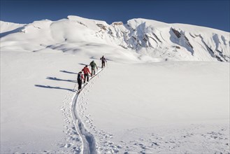 Ski tourers climbing Seekofel mountain