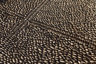 Pavement made from upright pebbles