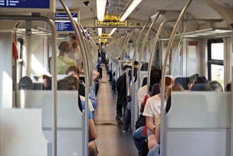 Rail passengers in a suburban train