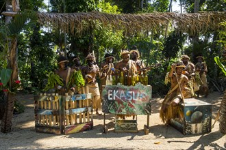 Group of traditional dressed men playing music