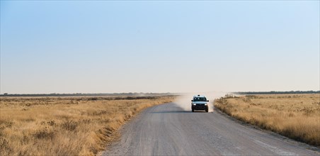 Car travelling on a dirt road