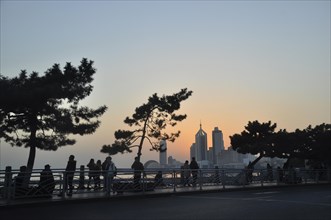 Waterfront promenade with the skyline of Qingdao