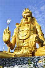 Golden Shiva statue in Hindu Shiva temple Koneswaram