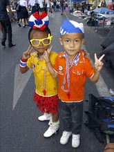 Two dressed up children making the V sign during an anti-government protest