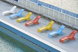 Deckchairs beside the pool at Parnell Baths