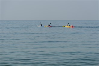 Kayakers in the open sea