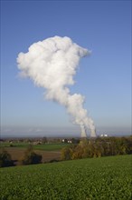 Mushroom-shaped cloud over the cooling towers of the Gundremmingen nuclear power plant