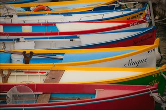 Colourful fishing boats in a small harbour of Lake Garda