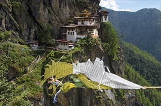 Buddhist prayer flags fluttering at the Tiger's Nest Monastery