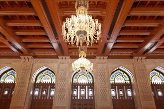 Prayer room for women with a wooden ceiling and a chandelier