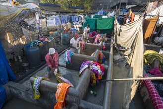 Labourers are washing clothes at Mahalaxmi Dhobi Ghat