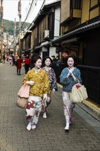 Geishas walking in the Geisha quarter Gion
