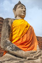 Buddha statue next to the central stupa