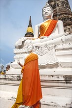 Buddha statues in front of the stupa at Wat Yai Chai Mongkhon