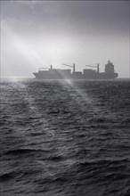 Container ship in bad weather on the high seas off Africa