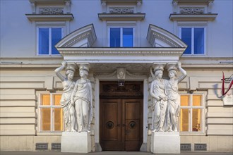 Caryatids at the entrance to the Palais Pallavicini