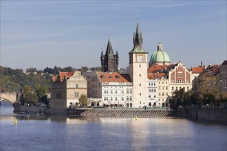 View over the Vltava River to the Bedrich Smetana Museum and the Old Town Bridge Tower