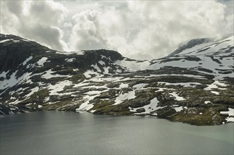 Djupvatnet Lake with snow-capped mountains
