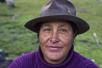 Friendly Quechua Indian woman wearing a hat