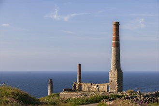 Ruins and chimney of the crushing plant of the former tin and copper mine Levant Mine