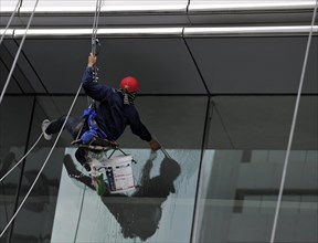 Window cleaner cleaning a window pane