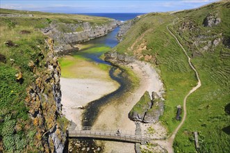 Sea inlet with a trail to a viewpoint at Smoo Cave