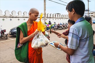 Monk receiving alms
