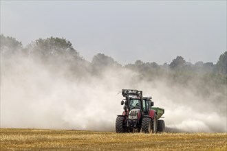 Tractor liming a field