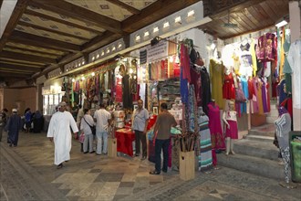 Customers and shops in the Muttrah Souq market