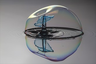 Three drops collide