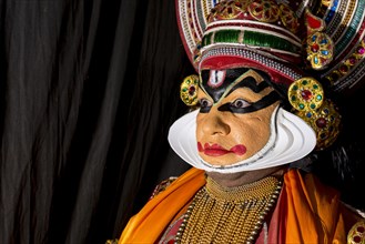 Katakali artist posing dressed up as Shiva
